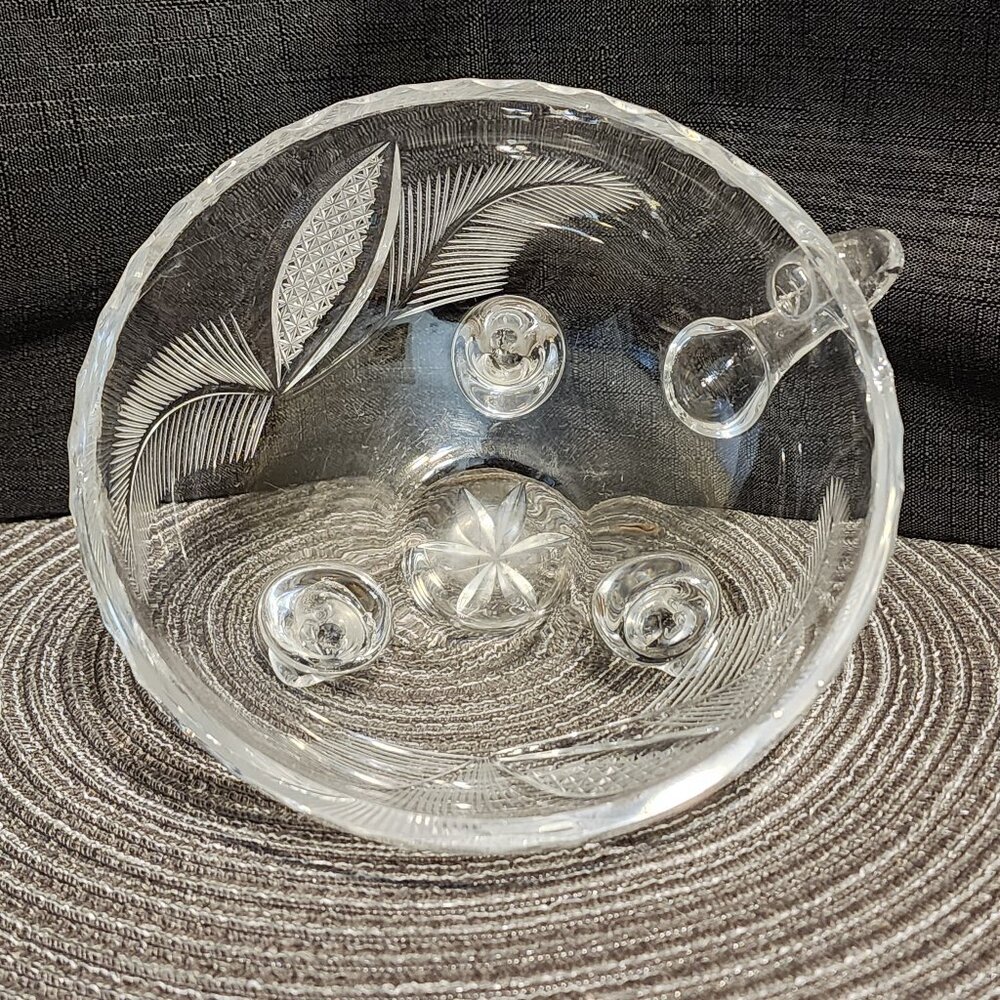 Tri-footed bowl with handle